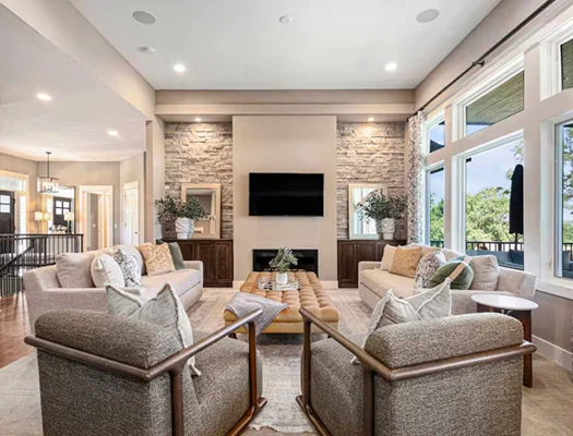 Luxury Airbnb living room with stone fireplace and modern seating