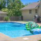 Backyard pool with peacock floaty